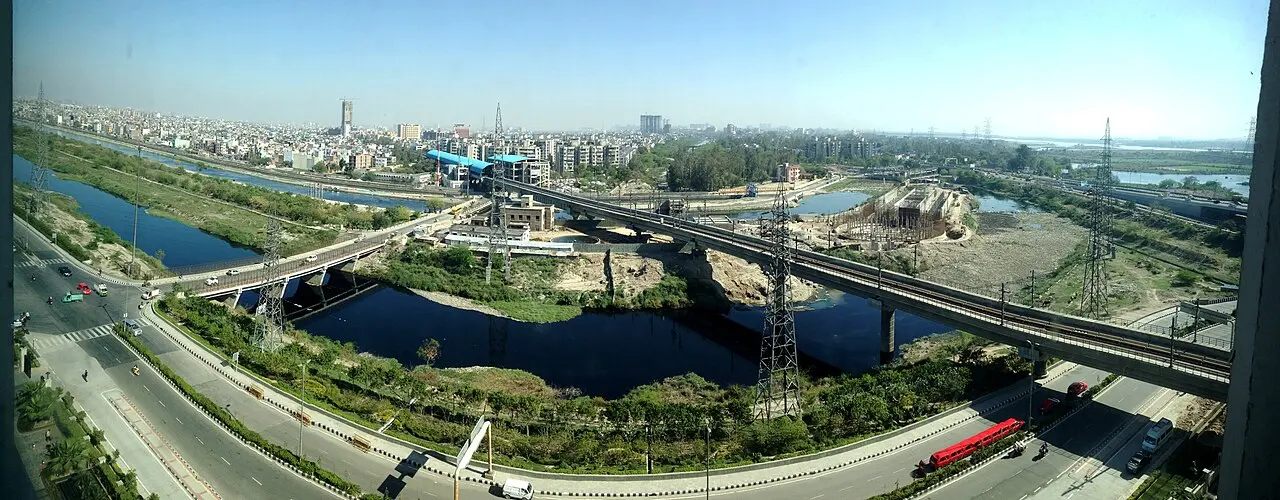 Aerial view of Noida roads, waterways, and buildings