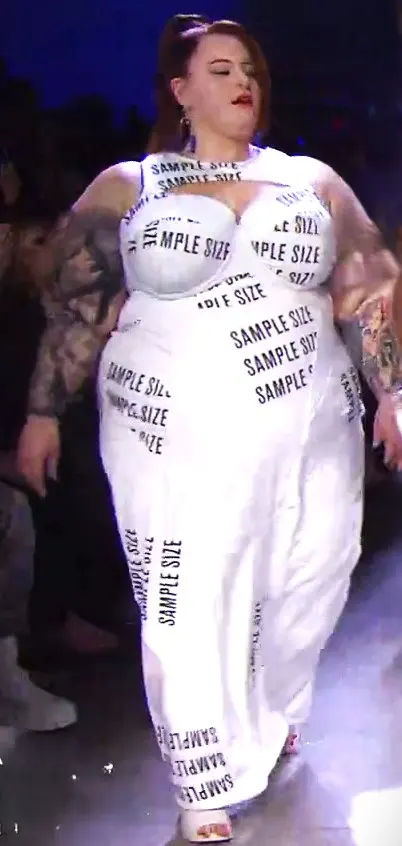 Plus-size model walking in a Chromat fashion show