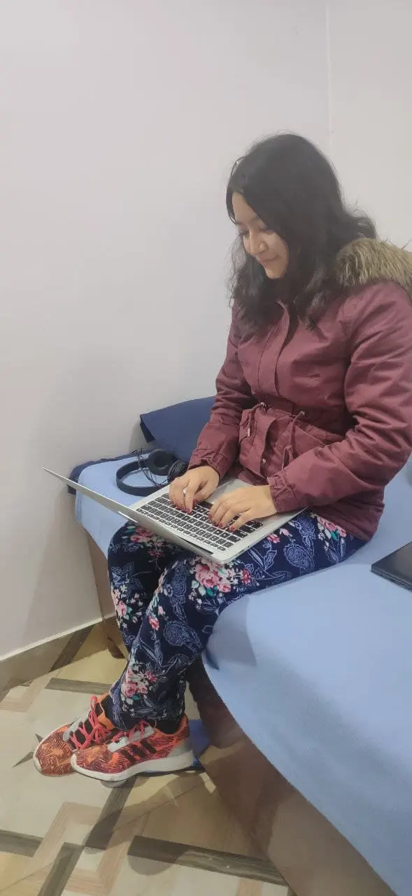 Adult woman working at a laptop
